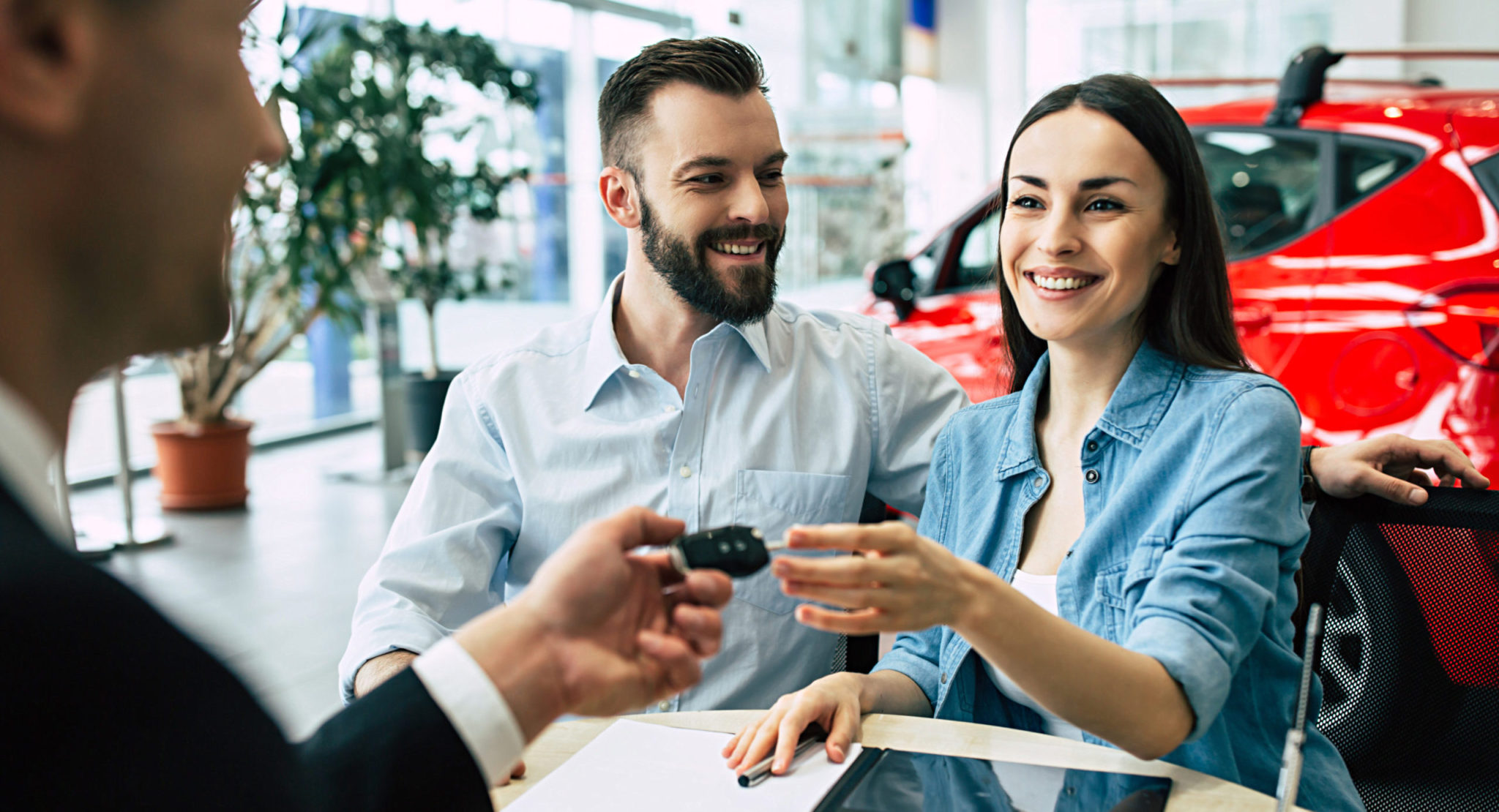 Beautiful Happy Couple Bought A Car In The Dealership